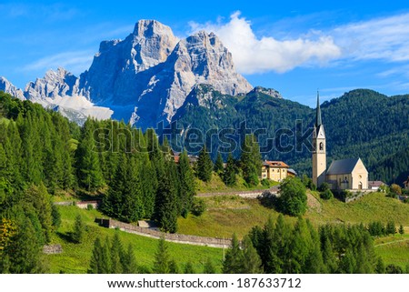 Church on top of hill in village of Pian near Selva di Cadore and beautiful mountains view, South Tirol, Dolomiti Mountains, Italy