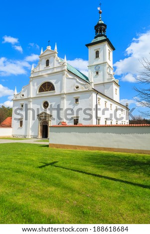 Green lawn courtyard of beautiful Camaldolese church in monastery of Rytwiany, Poland