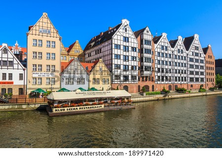 GDANSK, POLAND - JUN 8: restaurant on water in old town of Gdansk with view of Motlawa river and houses built in German architecture style on 8 June 2013. Gdansk for many years belonged to Germany.