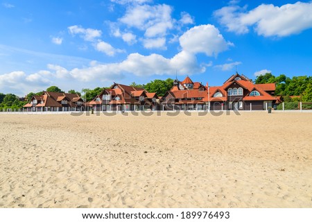 Traditional houses on sandy beach in Sopot seaside resort on coast of Baltic Sea, Poalnd