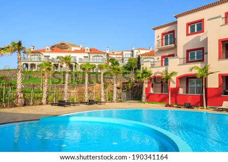 MADEIRA, PORTUGAL - AUG 27: Swimming pool of a luxury hotel on coast of Atlantic Ocean on 27 Aug 2013, Madeira island, Portugal. Best hotels in Portugal are located on Madeira island.