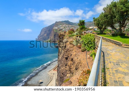 Promenade along a coast and Cabo Girao cliff ocean view, Camara de Lobos town near Funchal, Madeira island, Portugal