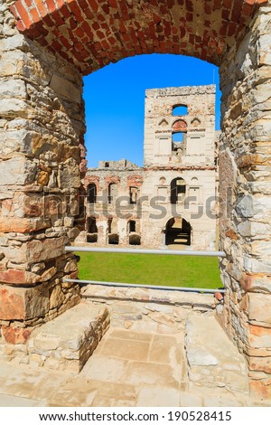 Tower of Krzyztopor castle framed in brick arch, Ujazd, Poland
