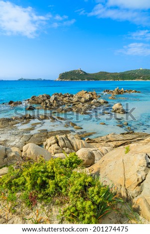 Rocks on beautiful beach and crystal clear azure sea water of Porto Giunco bay, Sardinia island, Italy