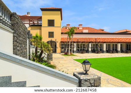 MADEIRA, PORTUGAL - AUG 27, 2013: colonial buildings in luxury hotel on coast of Atlantic Ocean. Madeira island is famous for best hotels in Portugal and for climate of eternal spring.