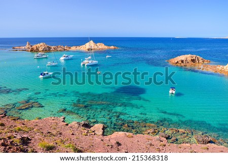 Yacht boats on beautiful sea water near Cavalleria beach, Menorca, Balearic Islands, Spain