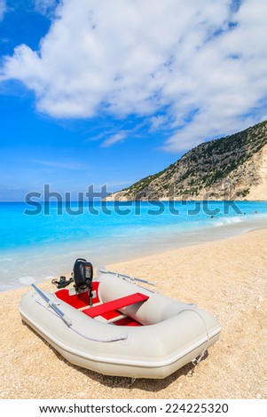 Pontoon boat on idyllic Myrtos beach, Kefalonia island, Greece