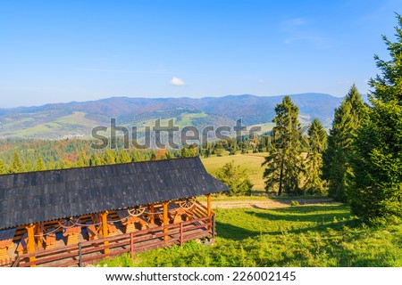 Mountain house on hill in Pieniny Mountains on sunny autumn day, Poland