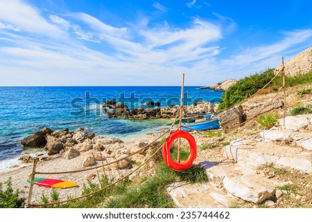 Life ring on path to Petani beach on coast of Kefalonia island, Greece