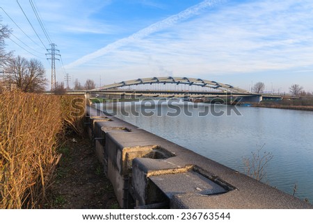 KRAKOW, POLAND - DEC 10, 2014: steel bridge over Vistula river in Krakow. Public transport connects two sides of Krakow city separated by Vistula river.
