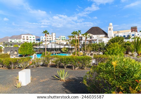 MARINA RUBICON, LANZAROTE ISLAND - JAN 11, 2015: Volcan hotel garden with villas in Rubicon marina, which is a part of Playa Blanca holiday resort town. Canary Islands are popular holiday destination.