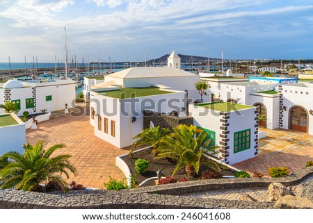 Square with typical Canary style houses in marina Rubicon, Lanzarote island, Spain