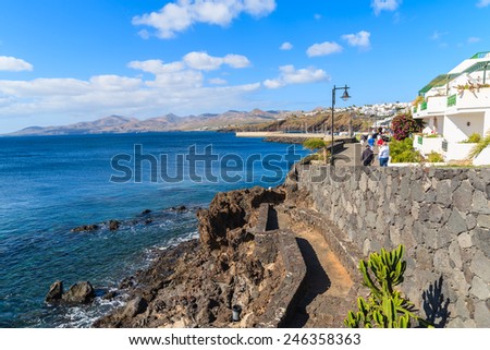 Promenade along ocean coast in Puerto del Carmen holiday town, Lanzarote, Canary Islands, Spain