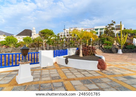 Square with typical Canary style houses in marina Rubicon, Lanzarote island, Spain