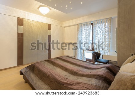 Interior design: modern bedroom in luxury apartment in Krakow city, Poland