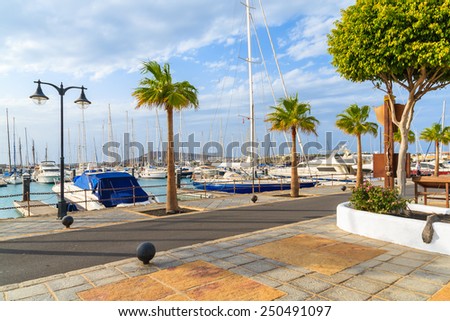 Coastal promenade in marina Rubicon with yacht boats mooring, Lanzarote, Canary Islands, Spain