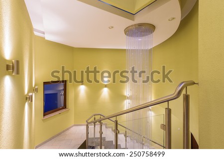 Chandelier in modern city building with luxury apartments, Krakow city, Poland