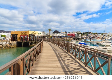 MARINA RUBICON, LANZAROTE ISLAND- JAN 17, 2015: footbridge in Rubicon port. Canary Islands are very popular holiday destination due to sunny tropical climate all year round.