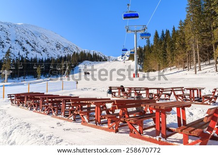 Tables in restaurant on ski slope in Rohace winter resort, Tatra Mountains, Slovakia