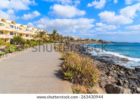 Coastal promenade along ocean in Playa Blanca holiday resort town, Lanzarote island, Spain