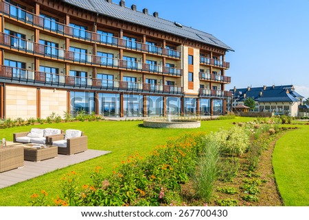 ARLAMOW HOTEL, POLAND - AUG 3, 2014: green garden in Arlamow Hotel. This luxury resort was owned by Poland\'s government and is located in Bieszczady Mountains.