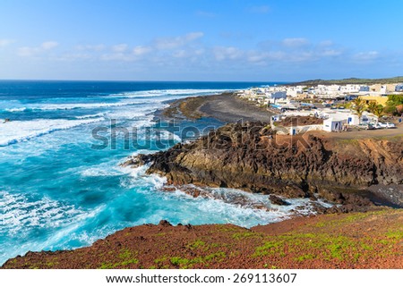 View of El Golfo village and blue ocean on coast of Lanzarote island, Spain