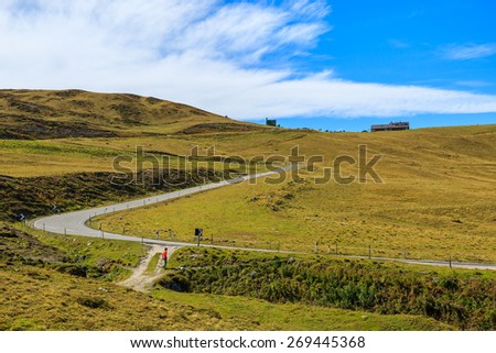 Road in autumn landscape of Dolomites Mountains near Passo Giau, South Tyrol, Italy