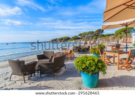 Beach furniture on sandy Palombaggia beach, Corsica island, France