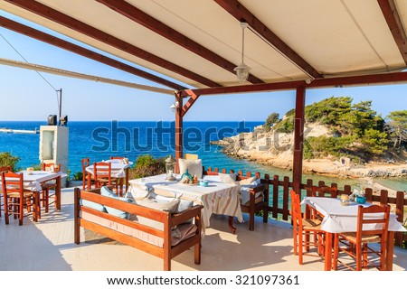 Typical Greek tavern in Kokkari bay, Samos island, Greece