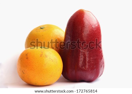 rose apple and orange on a white background
