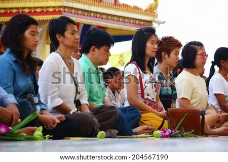 Ang Thong, Thailand-July 11,2014: Buddhists and monks meditation round the temple, in Asaha Puja Day and the beginning of Buddhist Lent, at Wat Muang- Ang Thong, Thailand.