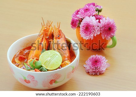 Tom Yum Kung or Sour prawn soup  is Thailand food on the wooden table