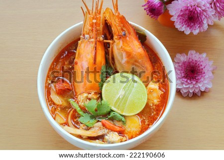 Tom Yum Kung or Sour prawn soup  is Thailand food on the wooden table