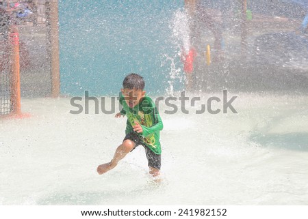 Hua Hin, Thailand - January 2:  Unidentified  tourists enjoy playing with water at the Asia\'s first water jungle Vana Nava, on January 2, 2015 at the Hua Hin, Thailand.