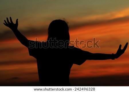 Women relaxing extend the arms in natural, silhouette