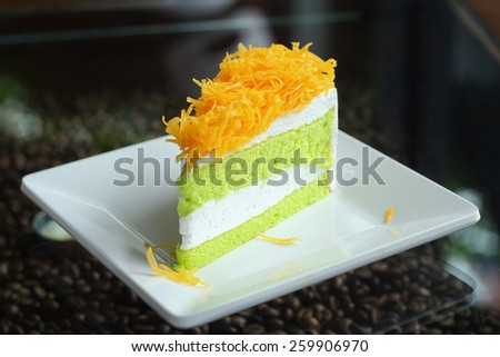 Thai dessert, Foythong Cake or Gold Egg Yolks Thread Cake is a dessert of Thailand, Made from egg placed on pandan cake.