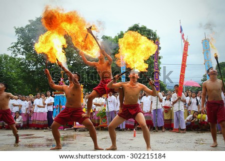 Chiang Mai, Thailand - July 29, 2015:  Performing arts fire sword dance, The arts of the ancient Lanna or ancient people of northern Thailand.