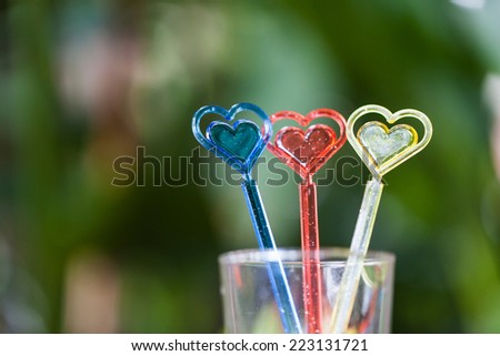 Mixer drinks. The composition of bartending accessories, colorful drinks stirrer