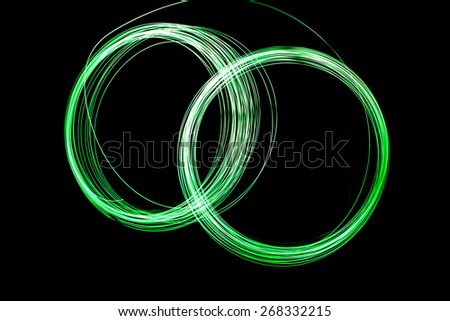 Abstract long exposure two cycle green neon lights texture soft focut.