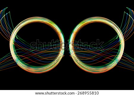 Abstract long exposure neon lights cycle texture soft focut.