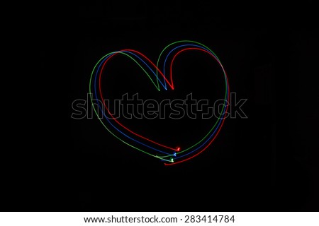 Long exposure small neon lights heart texture. Modern art. Abstract heart colorful neon light.