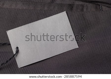 Dark background with paper pants label/Pants label
