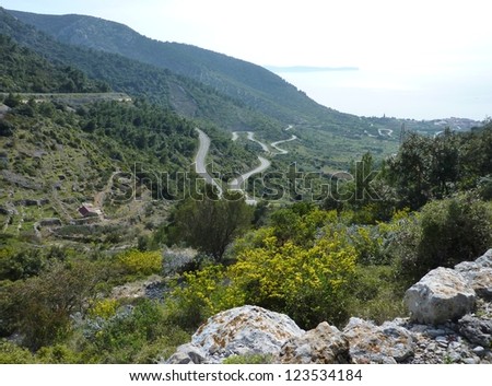 Landscape in spring with roads with hairpin bends at the island Vis in Croatia
