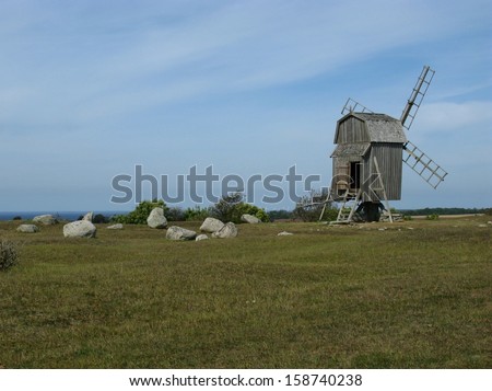 The burial ground of the village Gettlinge with  a wooden wind mill on the island Oeland in Sweden