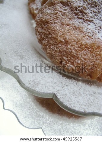 fritter of apple at a plate of glass with reflections
