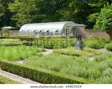 A garden with a hot house in summer