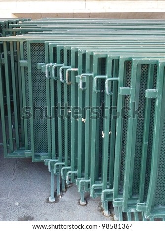 A stack of green crush barrier gates