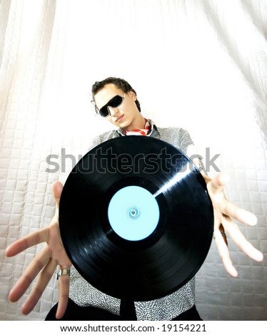DJ holding a vinyl disc