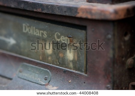 Old cash register machine with rust