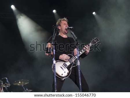 RIO DE JANEIRO, BRAZIL - SEPTEMBER 20: Chad Kroeger, lead vocalist of the Canadian band Nickelback, performs during the Rock in Rio 2013 concert, on September 20, 2013 in Rio de Janeiro, Brazil.